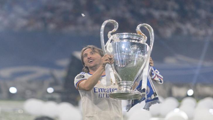 Luka Modric celebrates winning the Champions League